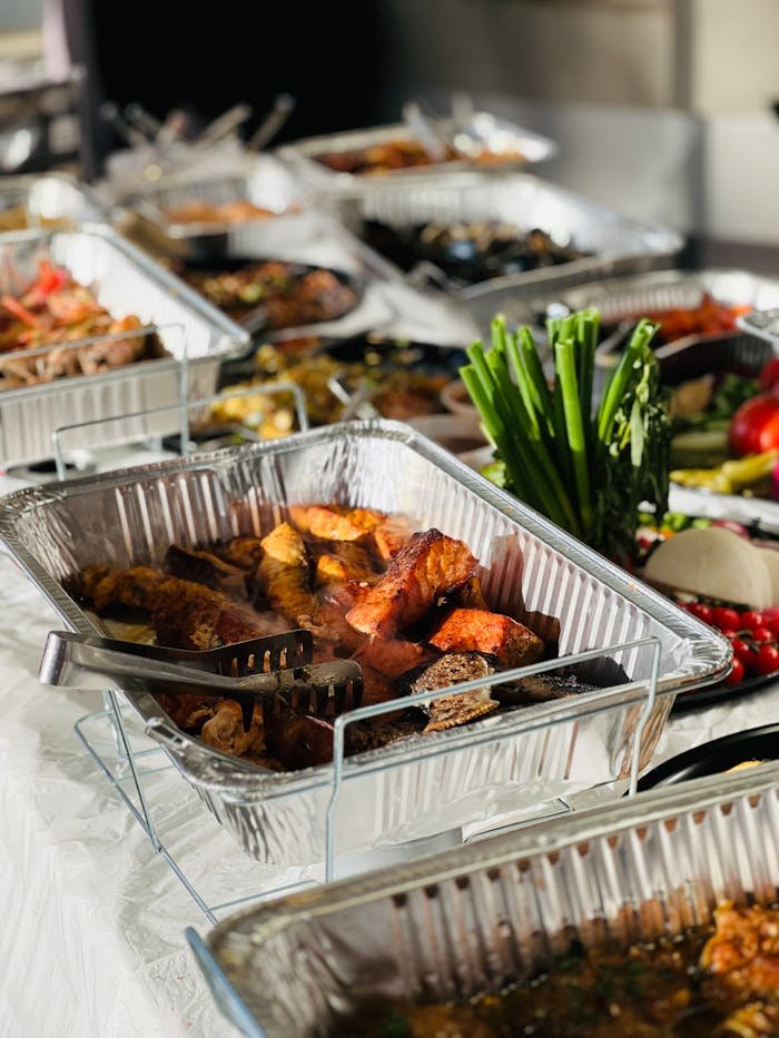 A mouth-watering buffet showcasing various cooked meats, perfect for celebrations.