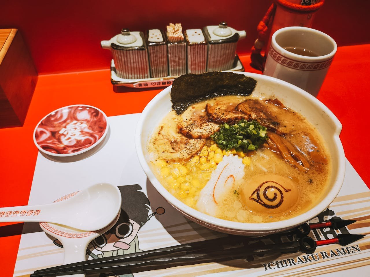 Close-up of a flavorful ramen bowl with toppings at Ichiraku Ramen.